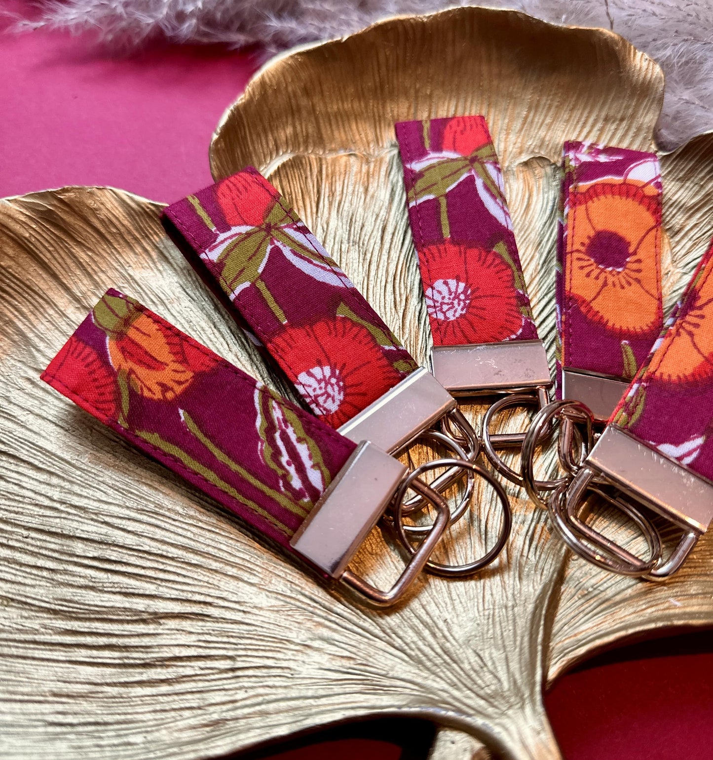 Small burgundy floral fabric keyring