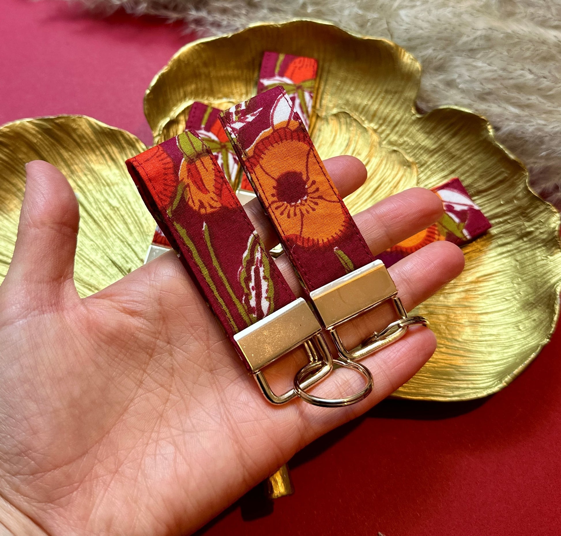 Small burgundy floral fabric keyring